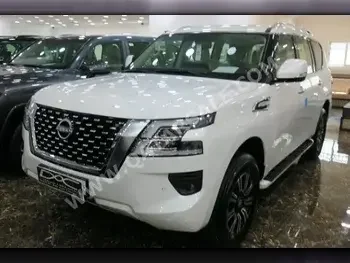 Nissan  Patrol  SE  2023  Automatic  0 Km  6 Cylinder  Four Wheel Drive (4WD)  SUV  White  With Warranty