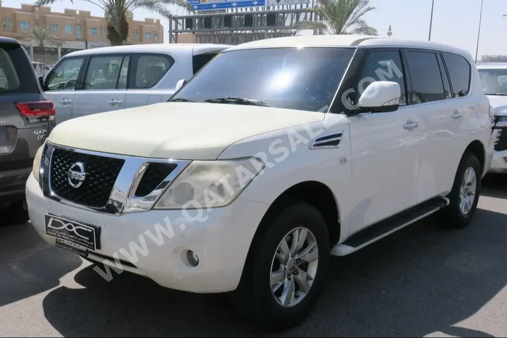 Nissan  Patrol  SE  2013  Automatic  178,000 Km  8 Cylinder  Four Wheel Drive (4WD)  SUV  White  With Warranty