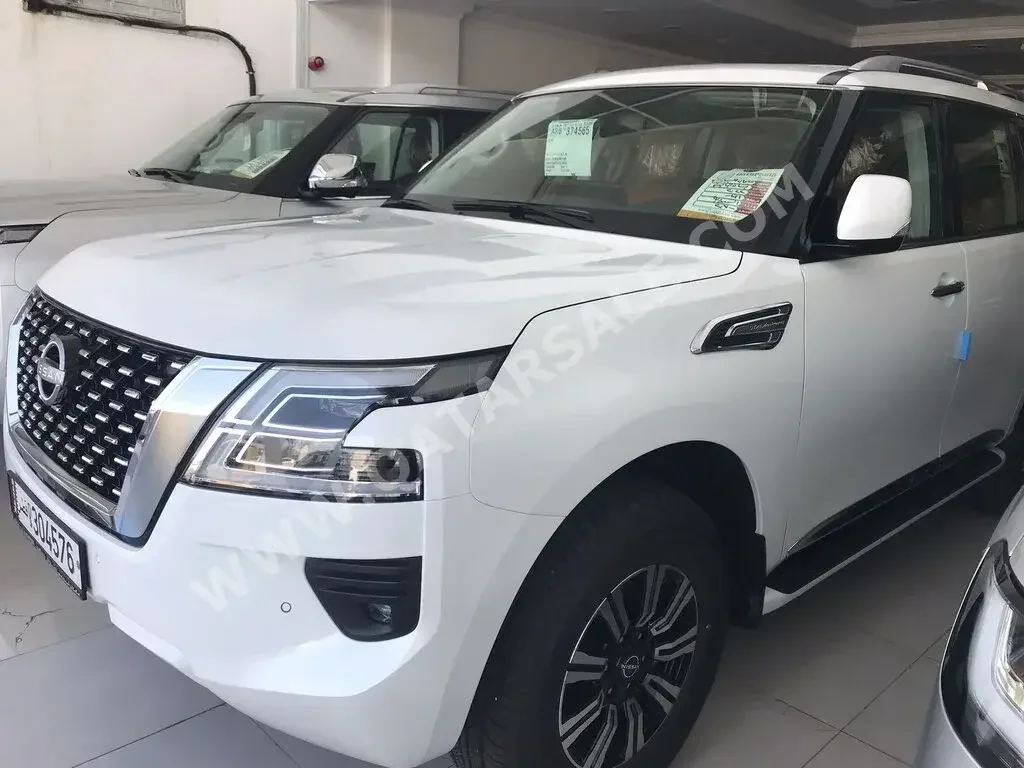 Nissan  Patrol  Titanium  2022  Automatic  0 Km  6 Cylinder  Four Wheel Drive (4WD)  SUV  White  With Warranty