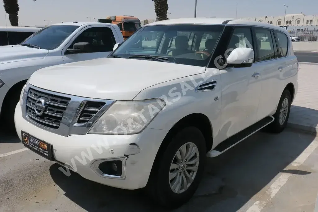 Nissan  Patrol  SE  2014  Automatic  205,000 Km  8 Cylinder  Four Wheel Drive (4WD)  SUV  White  With Warranty