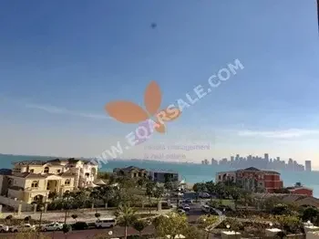 2 Bedrooms  Apartment  For Rent  in Doha -  The Pearl  Semi Furnished