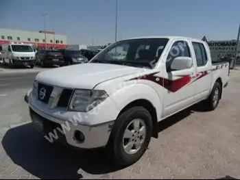 Nissan  Navara  2013  Manual  172,000 Km  4 Cylinder  Rear Wheel Drive (RWD)  Pick Up  White  With Warranty