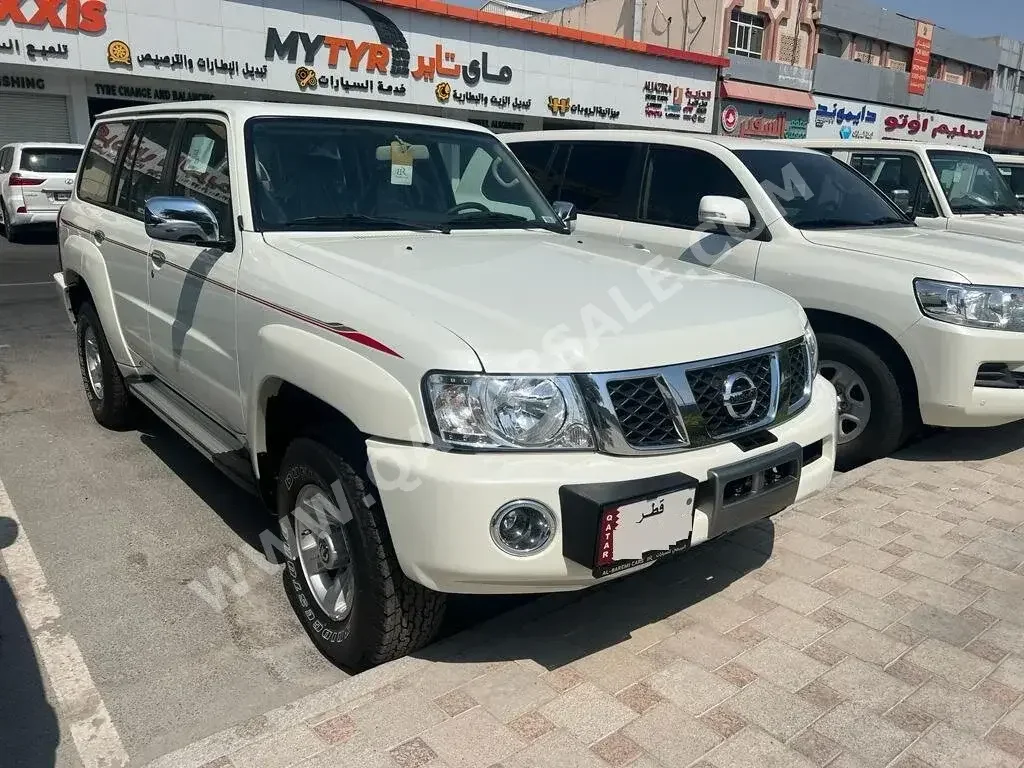 Nissan  Patrol  Safari  2023  Manual  0 Km  6 Cylinder  Four Wheel Drive (4WD)  SUV  White  With Warranty