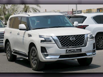 Nissan  Patrol  Titanium  2023  Automatic  33,000 Km  6 Cylinder  Four Wheel Drive (4WD)  SUV  White  With Warranty