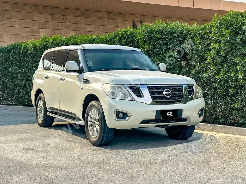 Nissan  Patrol  SE  2014  Automatic  230,000 Km  8 Cylinder  Four Wheel Drive (4WD)  SUV  White