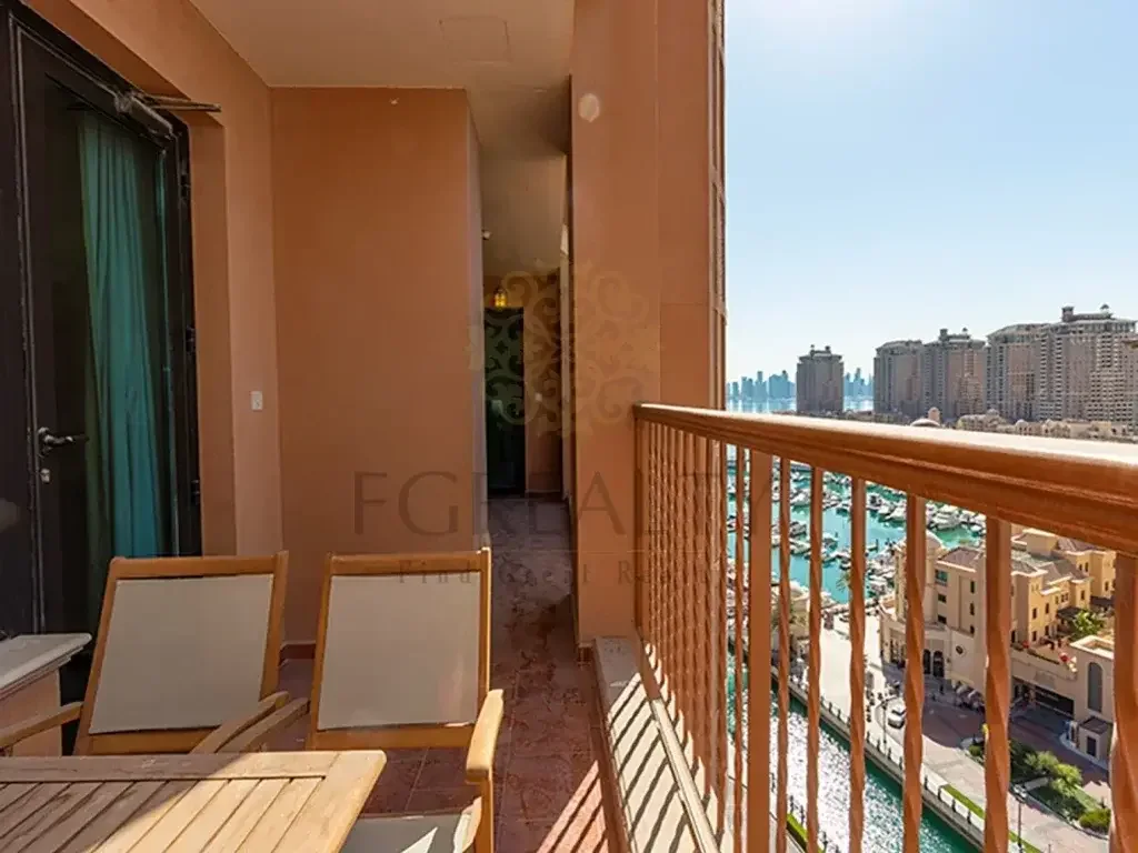 2 Bedrooms  Apartment  For Rent  in Doha -  The Pearl  Fully Furnished