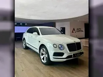 Bentley  Bentayga  2019  Automatic  61,000 Km  8 Cylinder  Four Wheel Drive (4WD)  SUV  White  With Warranty