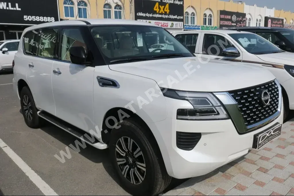 Nissan  Patrol  XE  2023  Automatic  0 Km  6 Cylinder  Four Wheel Drive (4WD)  SUV  White  With Warranty