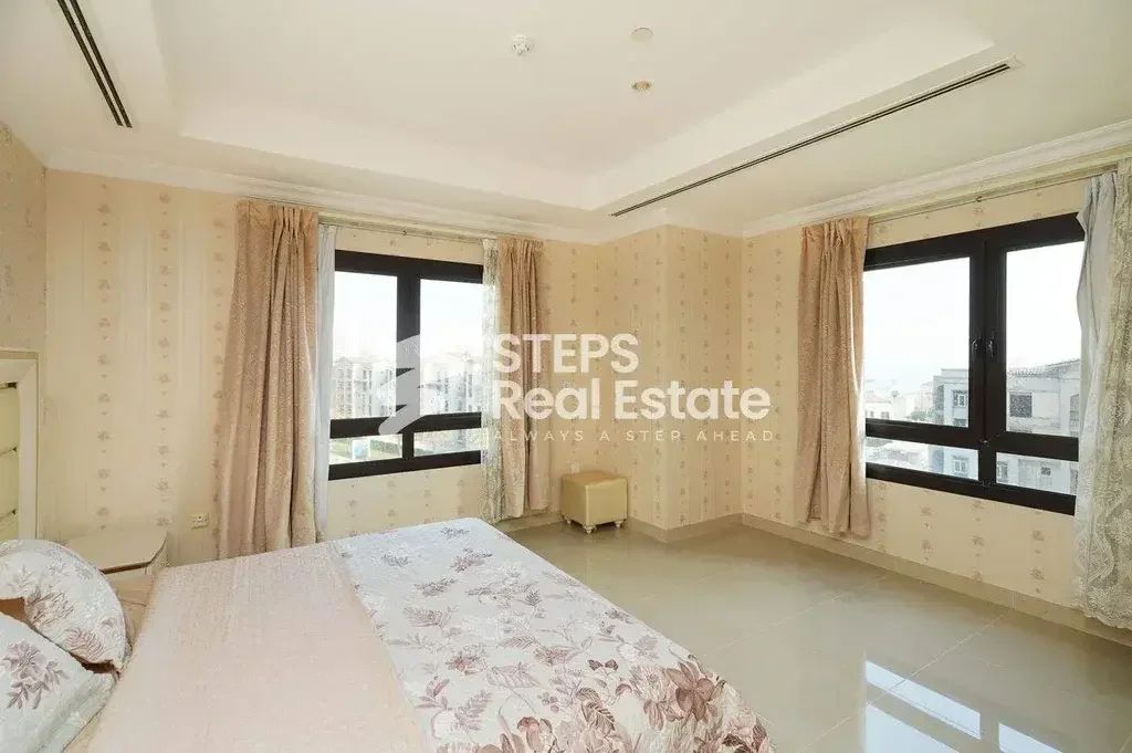 2 Bedrooms  Apartment  For Rent  in Doha -  The Pearl  Fully Furnished