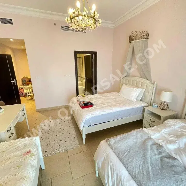 3 Bedrooms  Apartment  For Rent  in Doha -  The Pearl  Fully Furnished