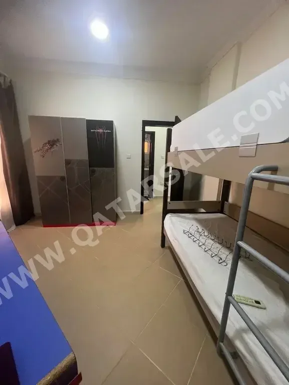 Labour Camp 2 Bedrooms  Apartment  For Rent  in Doha -  Rawdat Al Khail  Fully Furnished