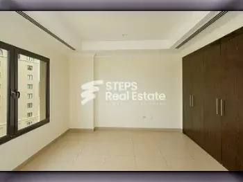 2 Bedrooms  Apartment  For Rent  in Doha -  The Pearl  Semi Furnished