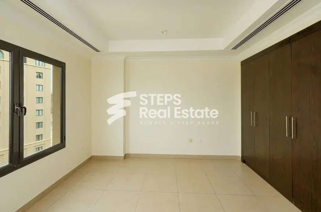 2 Bedrooms  Apartment  For Rent  in Doha -  The Pearl  Semi Furnished