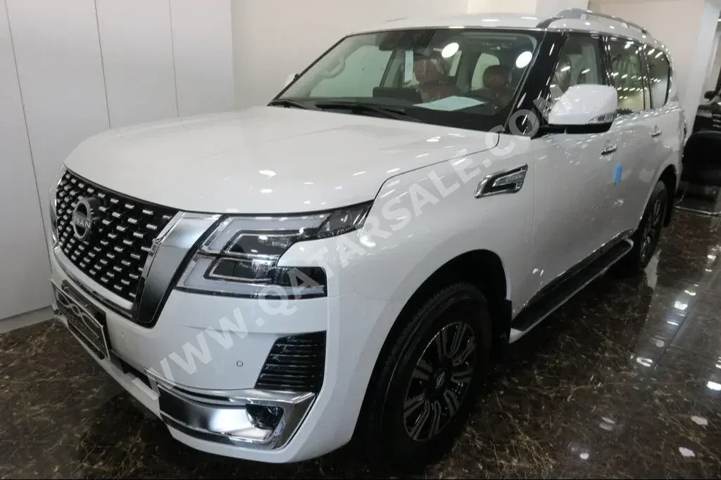 Nissan  Patrol  Titanium  2023  Automatic  0 Km  6 Cylinder  Four Wheel Drive (4WD)  SUV  White  With Warranty