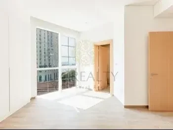 2 Bedrooms  Apartment  For Rent  in Doha -  The Pearl  Not Furnished