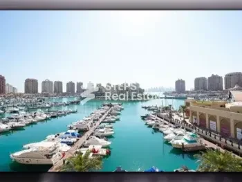 2 Bedrooms  Apartment  For Rent  in Doha -  The Pearl  Semi Furnished