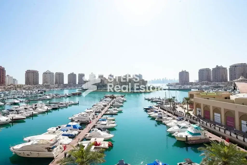 2 Bedrooms  Apartment  For Rent  in Doha -  The Pearl  Semi Furnished