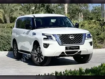 Nissan  Patrol  2023  Automatic  900 Km  6 Cylinder  Four Wheel Drive (4WD)  SUV  White  With Warranty