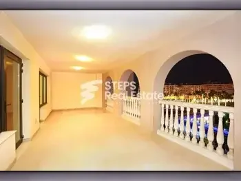 2 Bedrooms  Apartment  For Rent  in Doha -  The Pearl  Semi Furnished