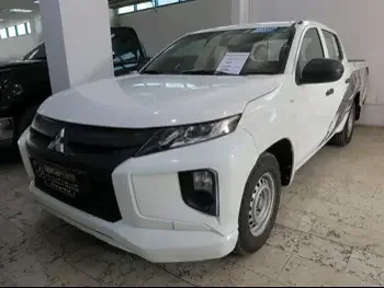 Mitsubishi  L 200  2018  Manual  154,000 Km  4 Cylinder  Rear Wheel Drive (RWD)  Pick Up  White