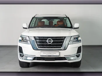 Nissan  Patrol  LE Titanium  2021  Automatic  904 Km  8 Cylinder  Four Wheel Drive (4WD)  SUV  White  With Warranty