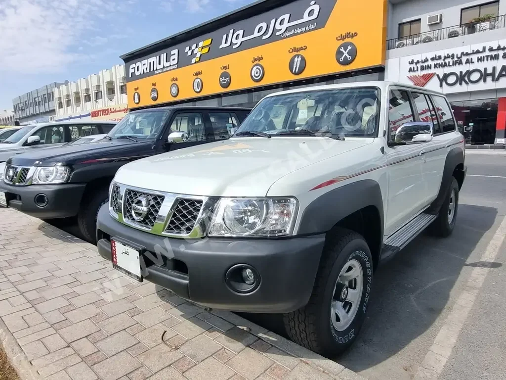  Nissan  Patrol  GL  2023  Automatic  0 Km  6 Cylinder  Four Wheel Drive (4WD)  SUV  White  With Warranty