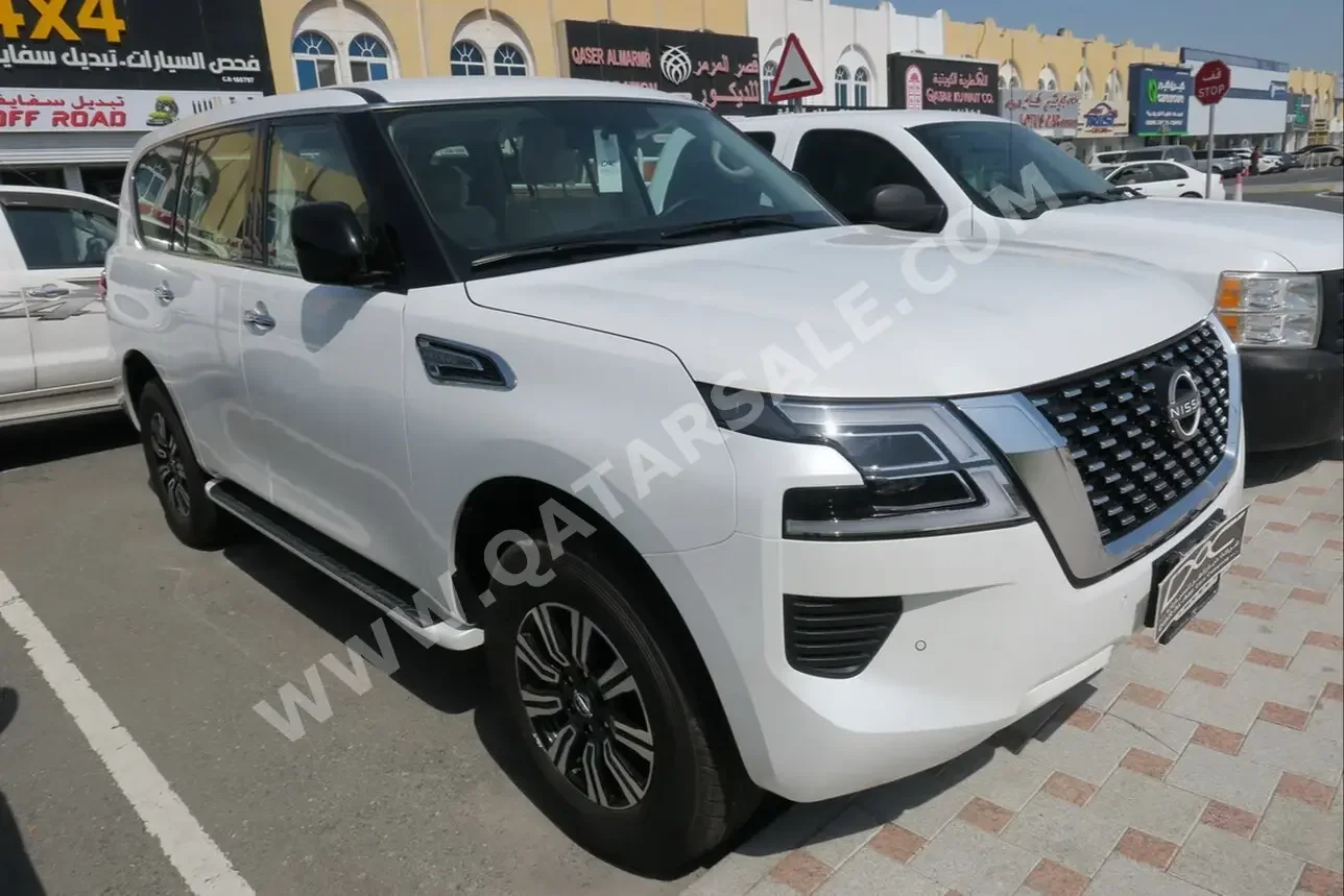 Nissan  Patrol  XE  2023  Automatic  0 Km  6 Cylinder  Four Wheel Drive (4WD)  SUV  White  With Warranty