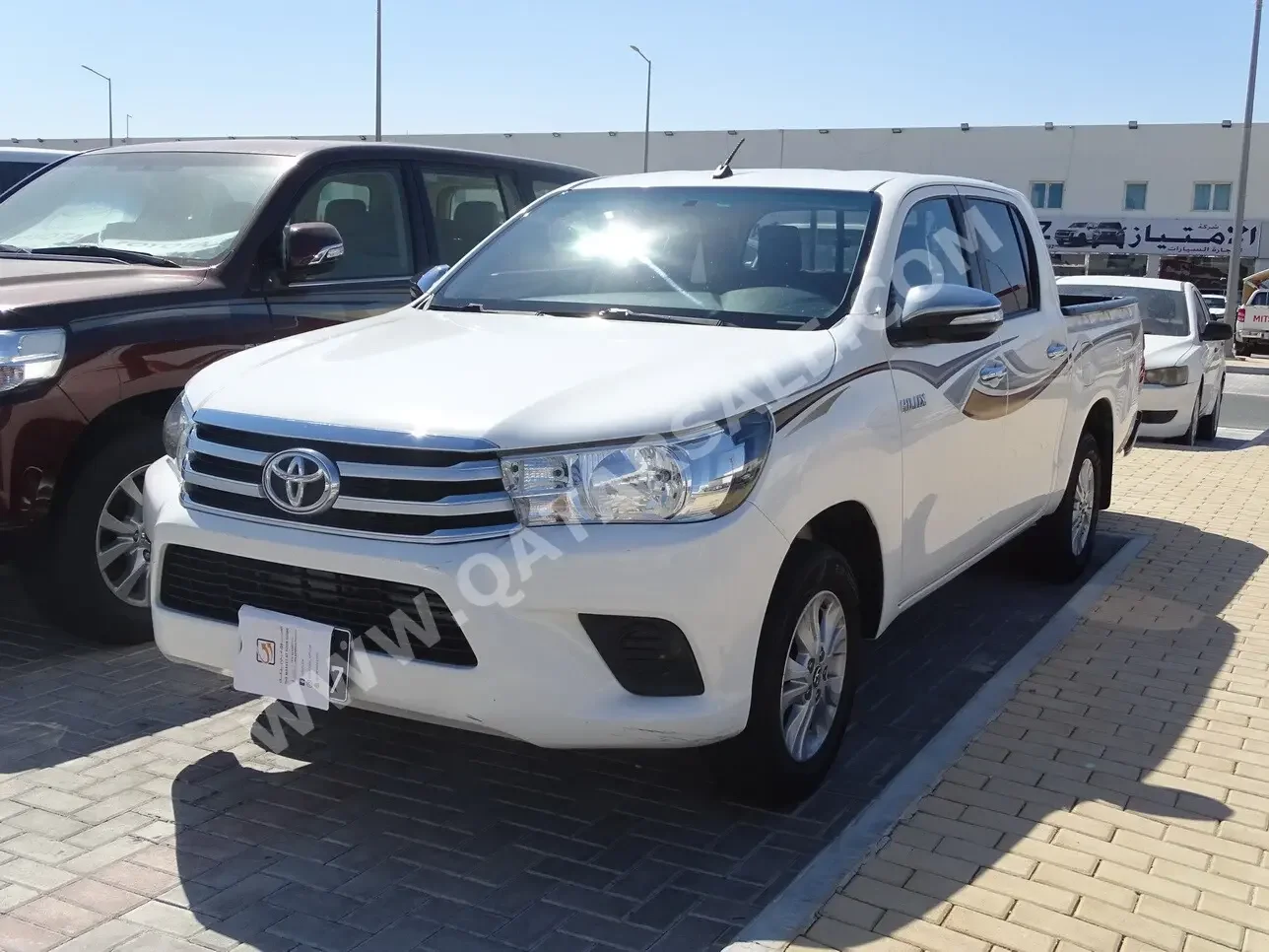 Toyota  Hilux  SR5  2019  Automatic  158,000 Km  4 Cylinder  Rear Wheel Drive (RWD)  Pick Up  White