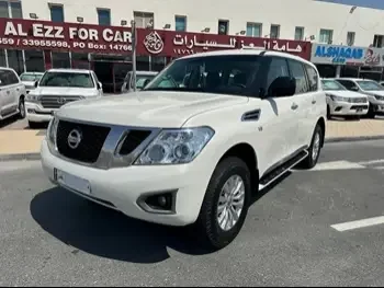 Nissan  Patrol  XE  2015  Automatic  121,000 Km  6 Cylinder  Four Wheel Drive (4WD)  SUV  White