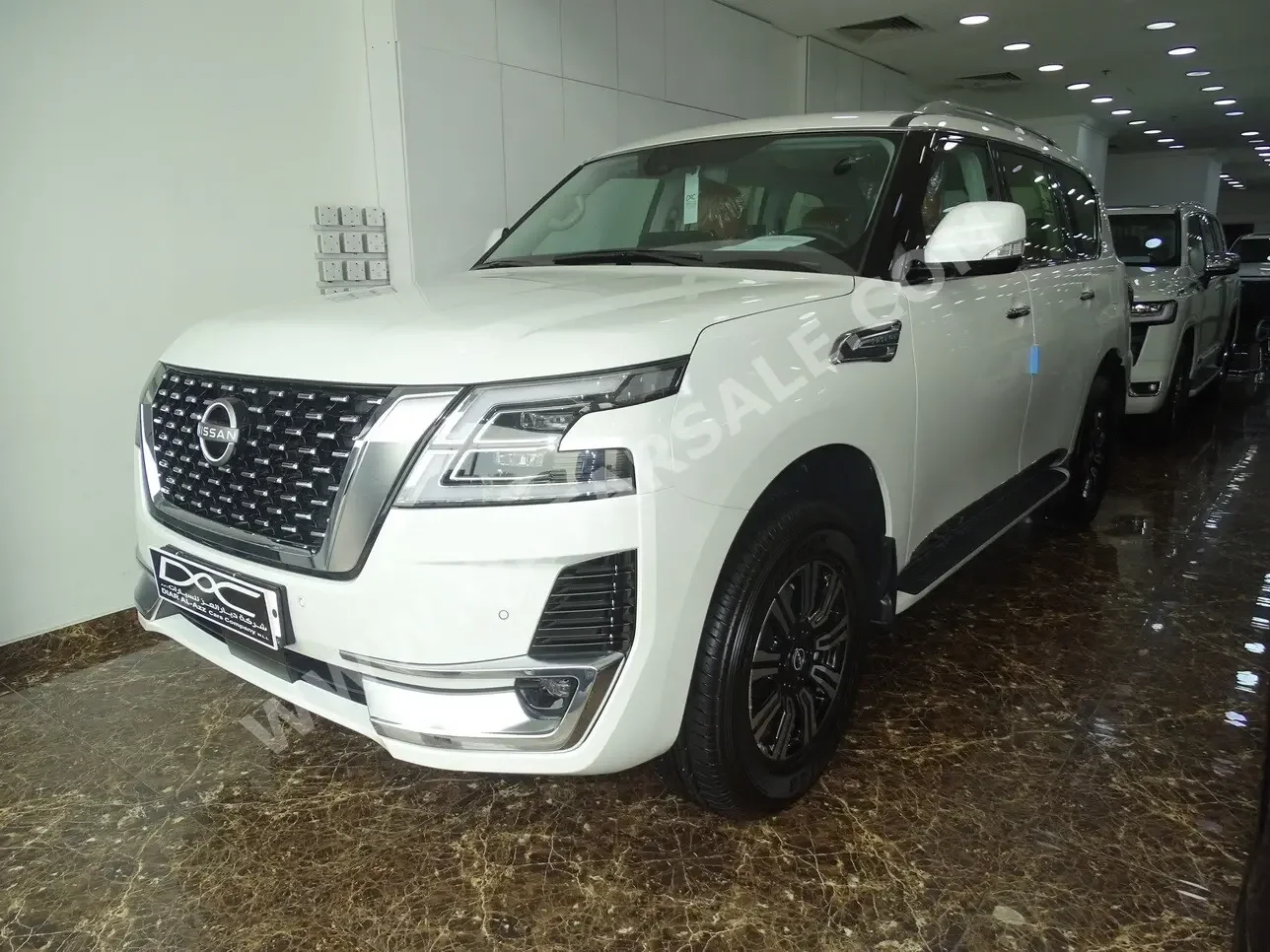 Nissan  Patrol  Titanium  2023  Automatic  0 Km  6 Cylinder  Four Wheel Drive (4WD)  SUV  White  With Warranty