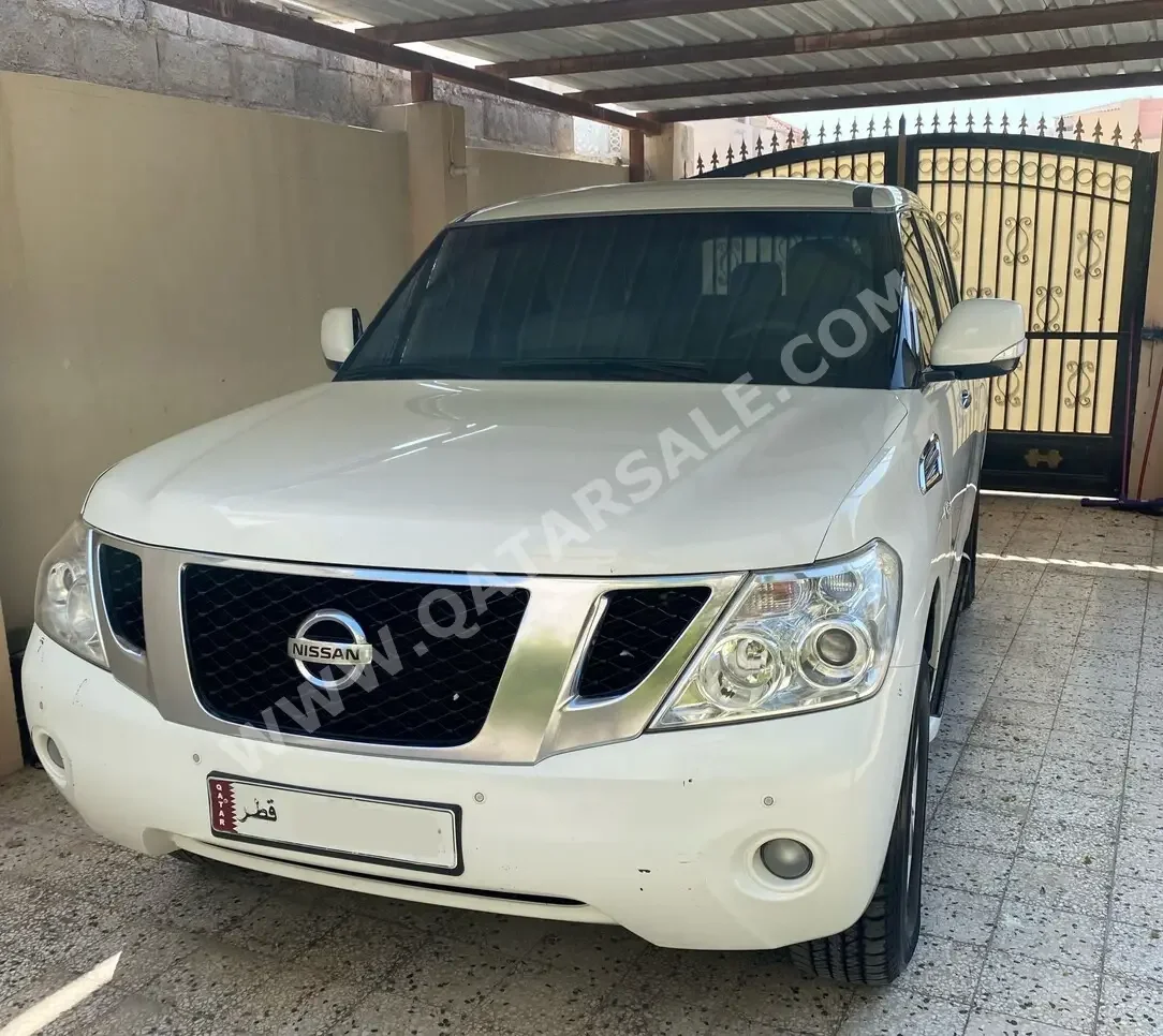 Nissan  Patrol  SE  2013  Automatic  240,000 Km  8 Cylinder  Four Wheel Drive (4WD)  SUV  Pearl