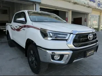 Toyota  Hilux  2022  Manual  15,000 Km  4 Cylinder  Four Wheel Drive (4WD)  Pick Up  White  With Warranty