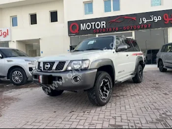 Nissan  Patrol  Super Safari  2022  Automatic  50,000 Km  6 Cylinder  Four Wheel Drive (4WD)  SUV  White  With Warranty