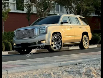 GMC  Yukon  Denali  2015  Automatic  38,000 Km  8 Cylinder  Four Wheel Drive (4WD)  SUV  Gold