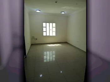 2 Bedrooms  Apartment  For Rent  in Doha -  Al Mansoura  Not Furnished