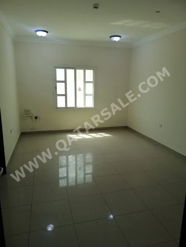 2 Bedrooms  Apartment  For Rent  in Doha -  Al Mansoura  Not Furnished