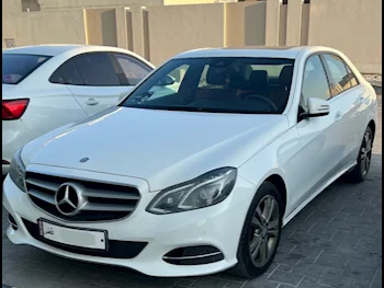 Mercedes-Benz  E-Class  200  2014  Automatic  95,000 Km  4 Cylinder  Rear Wheel Drive (RWD)  Sedan  White