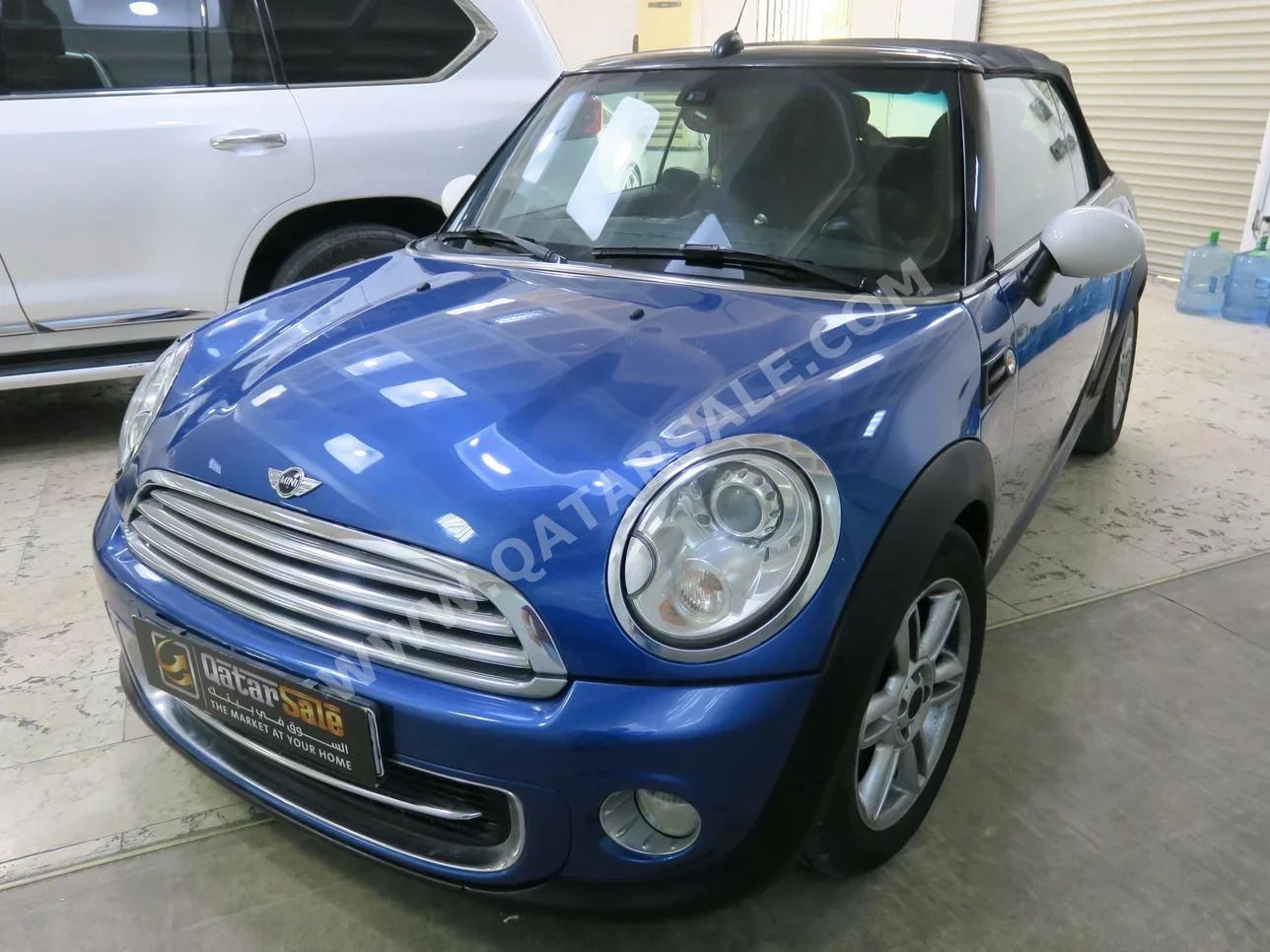 Mini  Cooper  2014  Automatic  88٬000 Km  4 Cylinder  Front Wheel Drive (FWD)  Convertible  Blue