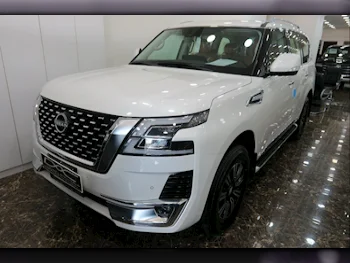 Nissan  Patrol  Titanium  2023  Automatic  0 Km  6 Cylinder  Four Wheel Drive (4WD)  SUV  White  With Warranty