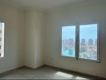 3 Bedrooms  Apartment  For Rent  in Doha -  The Pearl  Semi Furnished