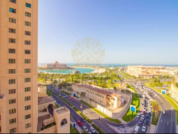 2 Bedrooms  Apartment  For Rent  in Doha -  The Pearl  Not Furnished