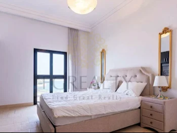 3 Bedrooms  Apartment  For Rent  in Doha -  The Pearl  Fully Furnished