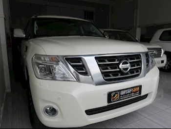 Nissan  Patrol  Platinum  2015  Automatic  223,000 Km  8 Cylinder  Four Wheel Drive (4WD)  SUV  White