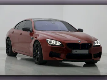 BMW  M-Series  6  2014  Automatic  145,000 Km  8 Cylinder  Rear Wheel Drive (RWD)  Sedan  Orange