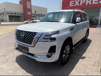 Nissan  Patrol  Titanium  2023  Automatic  0 Km  6 Cylinder  Four Wheel Drive (4WD)  SUV  White  With Warranty