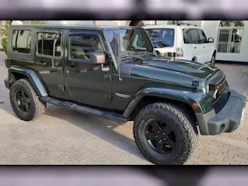 Jeep  Wrangler  Sahara  2010  Automatic  135,000 Km  6 Cylinder  Four Wheel Drive (4WD)  SUV  Dark Green