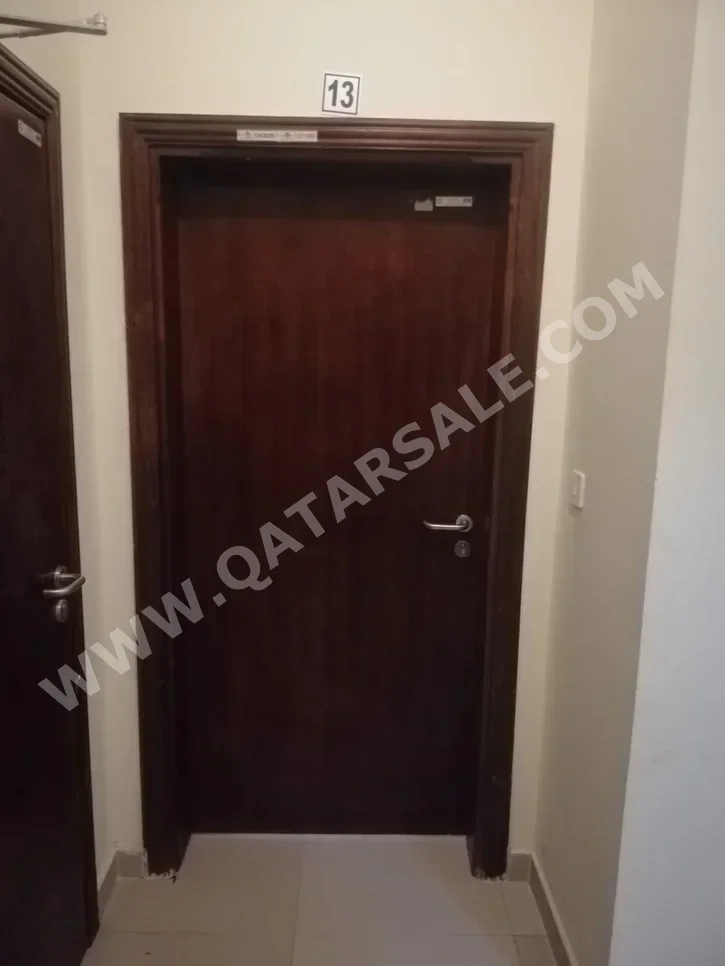 2 Bedrooms  Apartment  For Rent  in Doha -  Madinat Khalifa South  Not Furnished