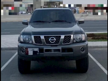 Nissan  Patrol  Safari  2021  Manual  66,000 Km  6 Cylinder  Four Wheel Drive (4WD)  SUV  Black and Gray  With Warranty