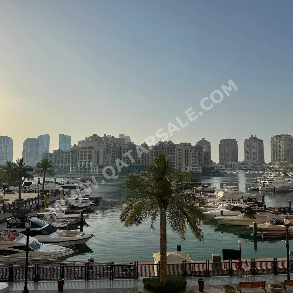 4 Bedrooms  Apartment  For Rent  in Doha -  The Pearl  Semi Furnished