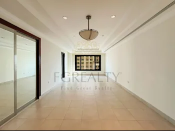 2 Bedrooms  Apartment  For Rent  in Doha -  The Pearl  Not Furnished